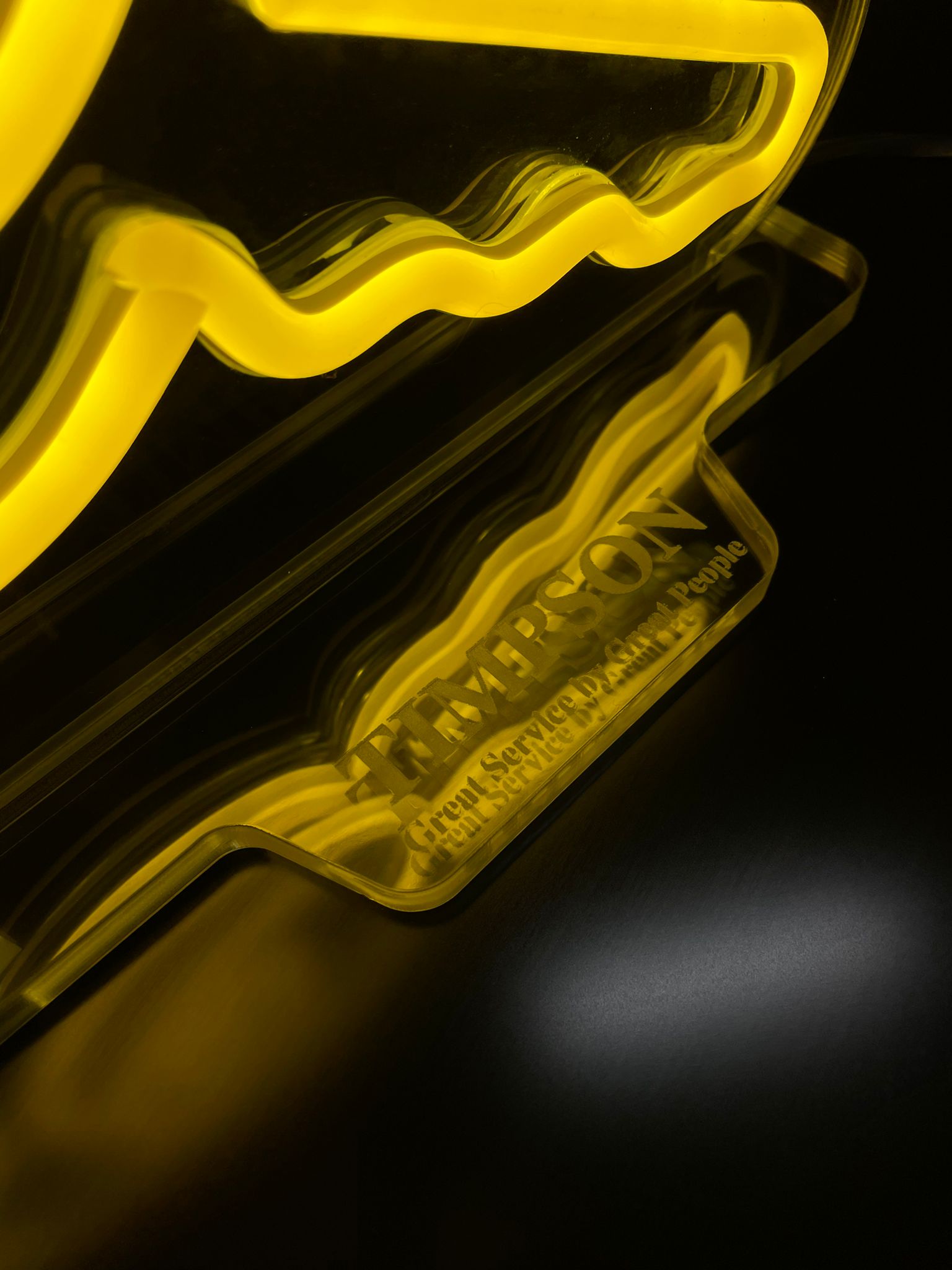 Timpson yellow neon close-up detail