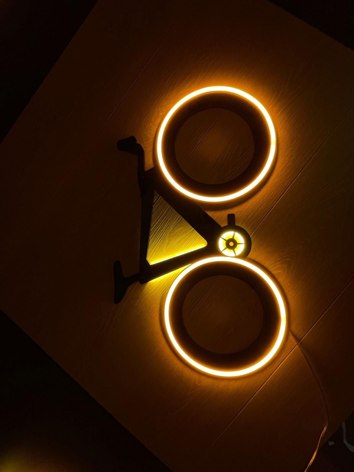 Halo-lit illuminated bicycle wall sign