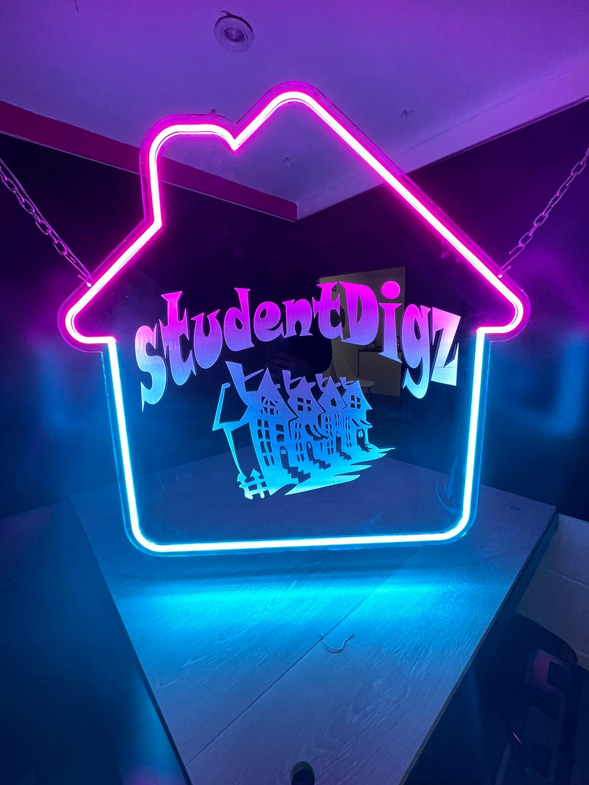 StudentDigz house-shaped neon sign