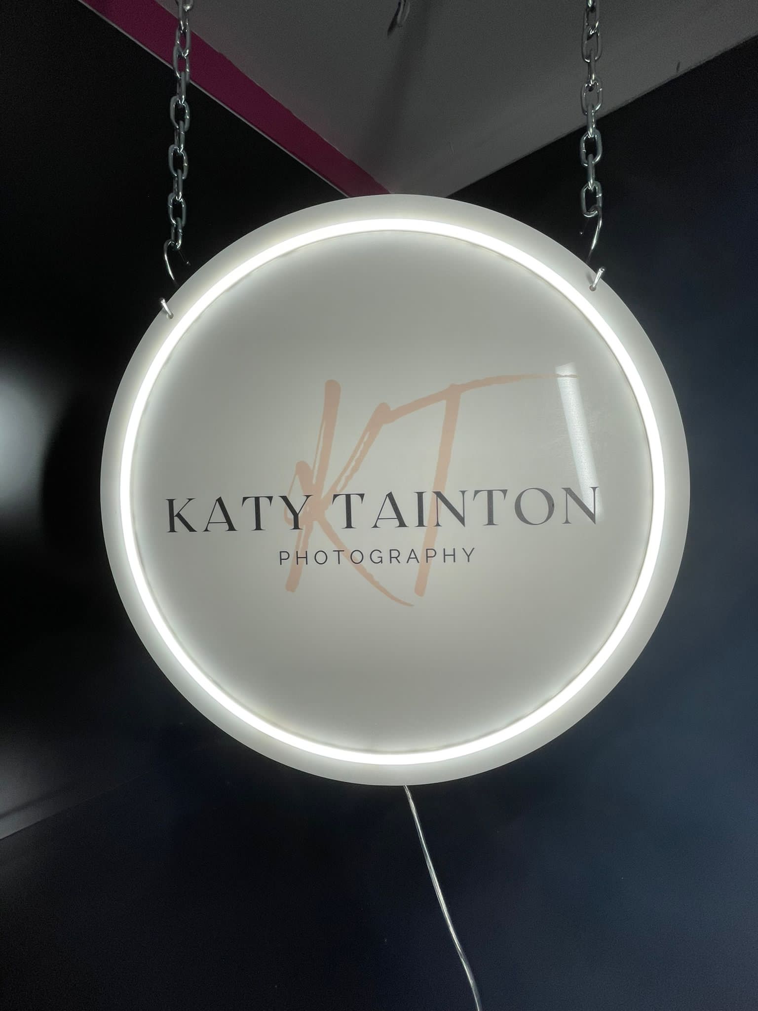 Katy Tainton Photography hanging illuminated disc sign