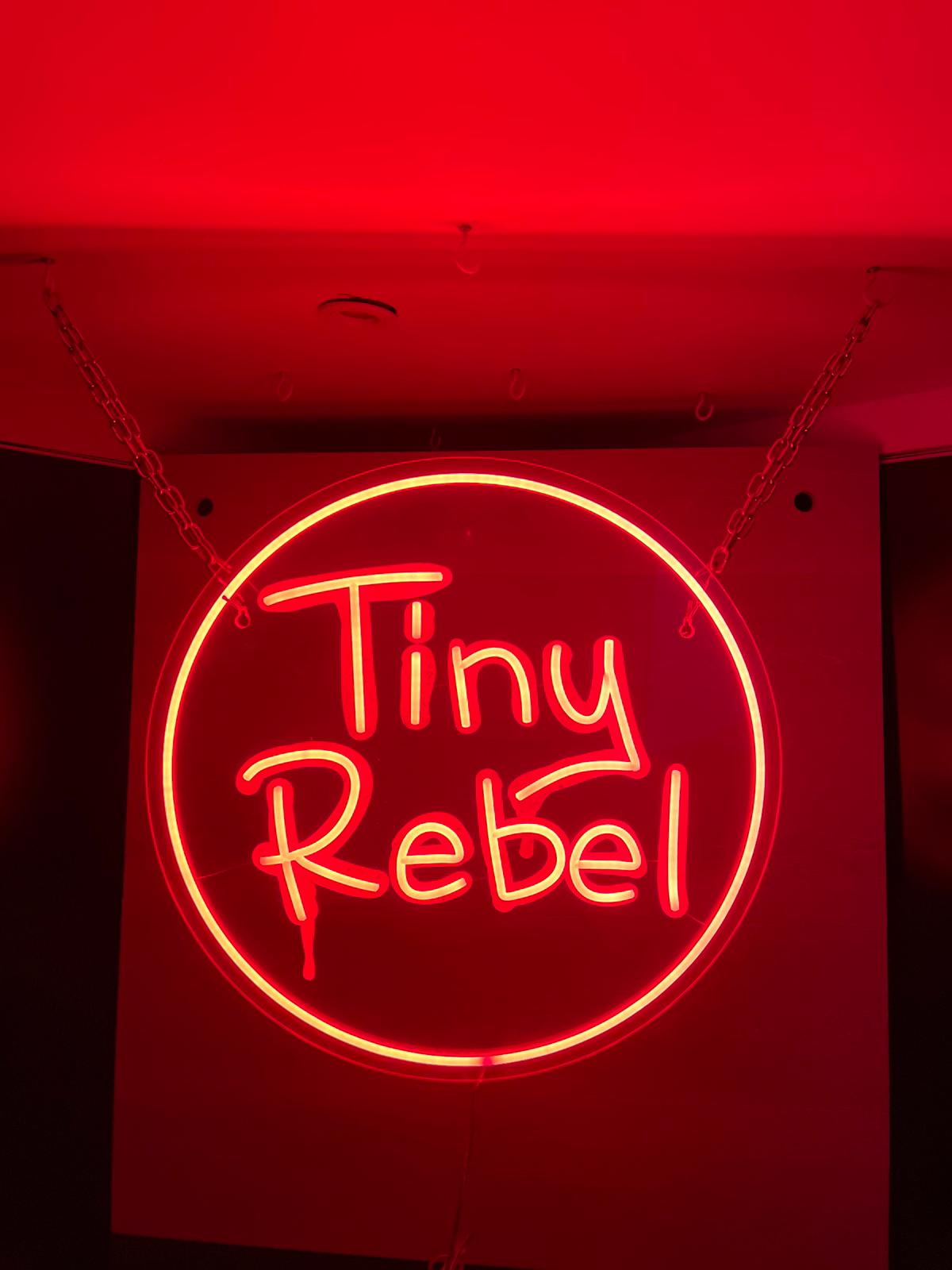 Tiny Rebel red circular neon installed