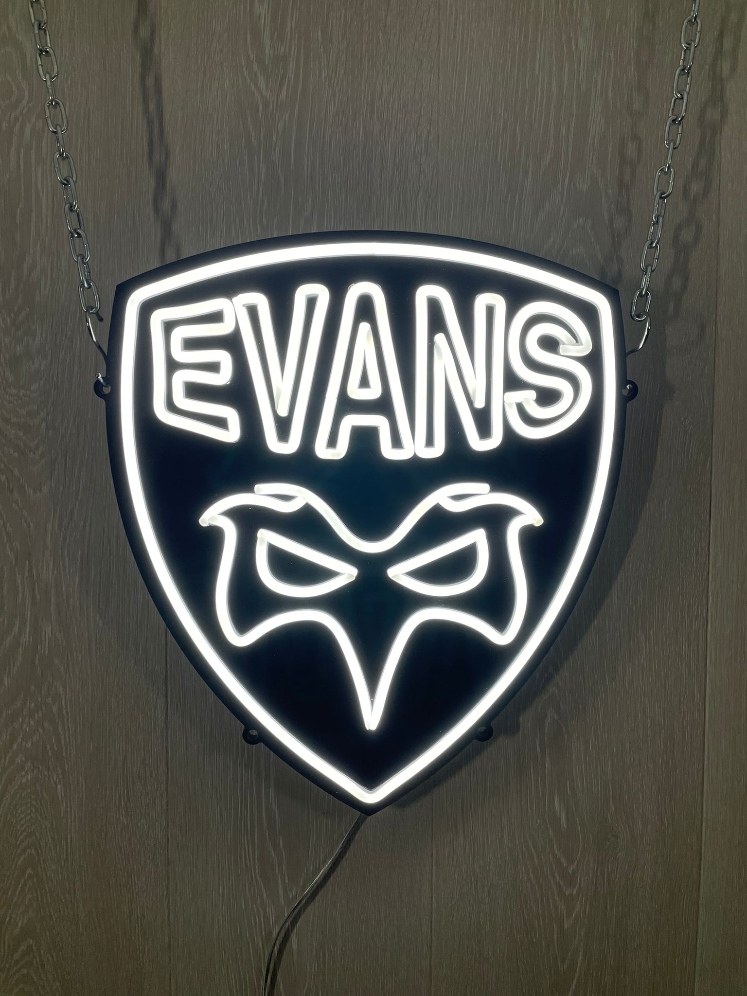 Evans shield-shaped white neon hung