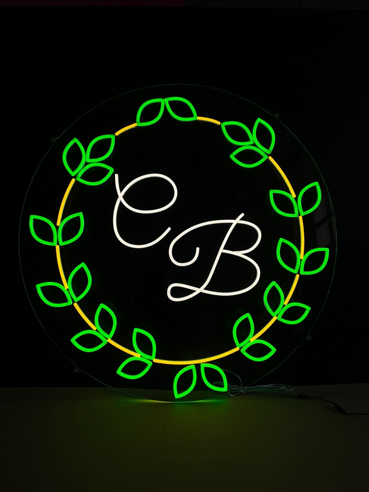 CB monogram with leaf wreath neon