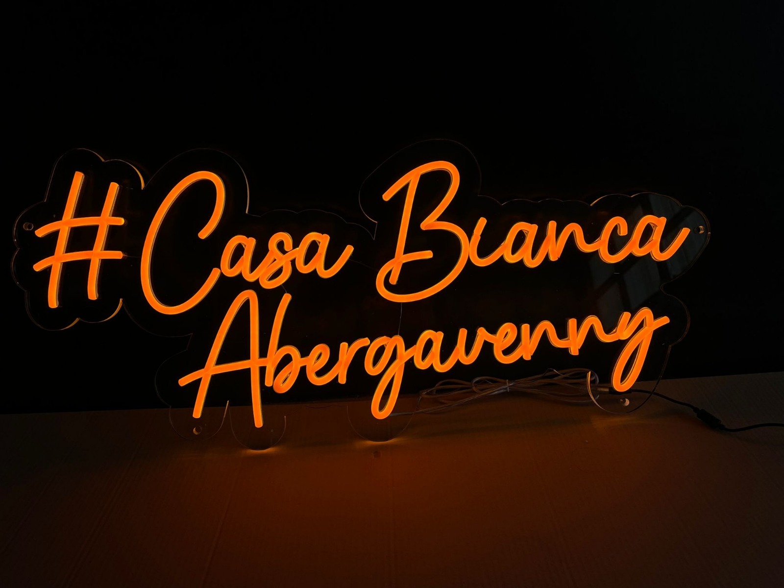 Casa Bianca Abergavenny orange script neon