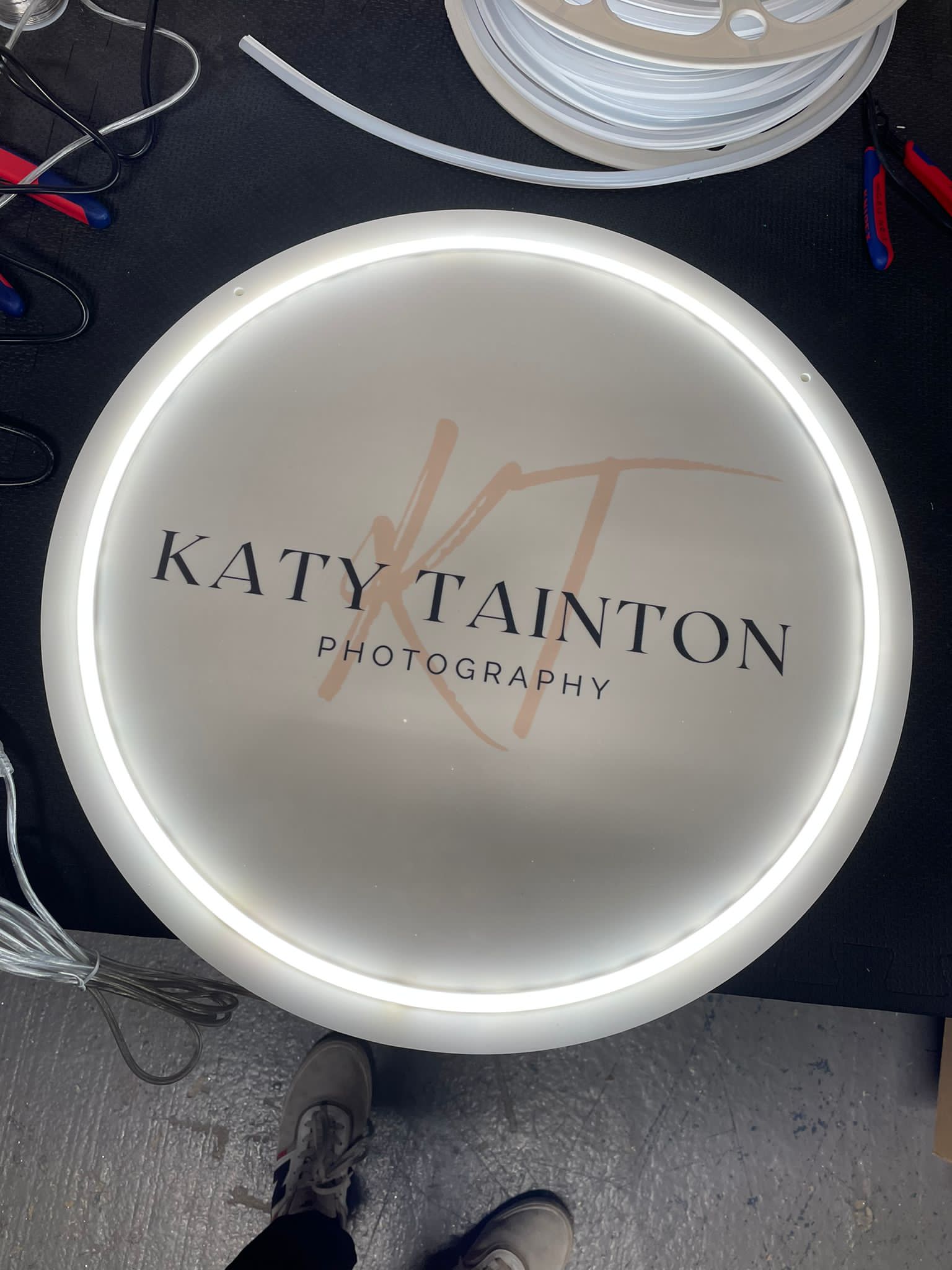 Katy Tainton illuminated disc sign in workshop