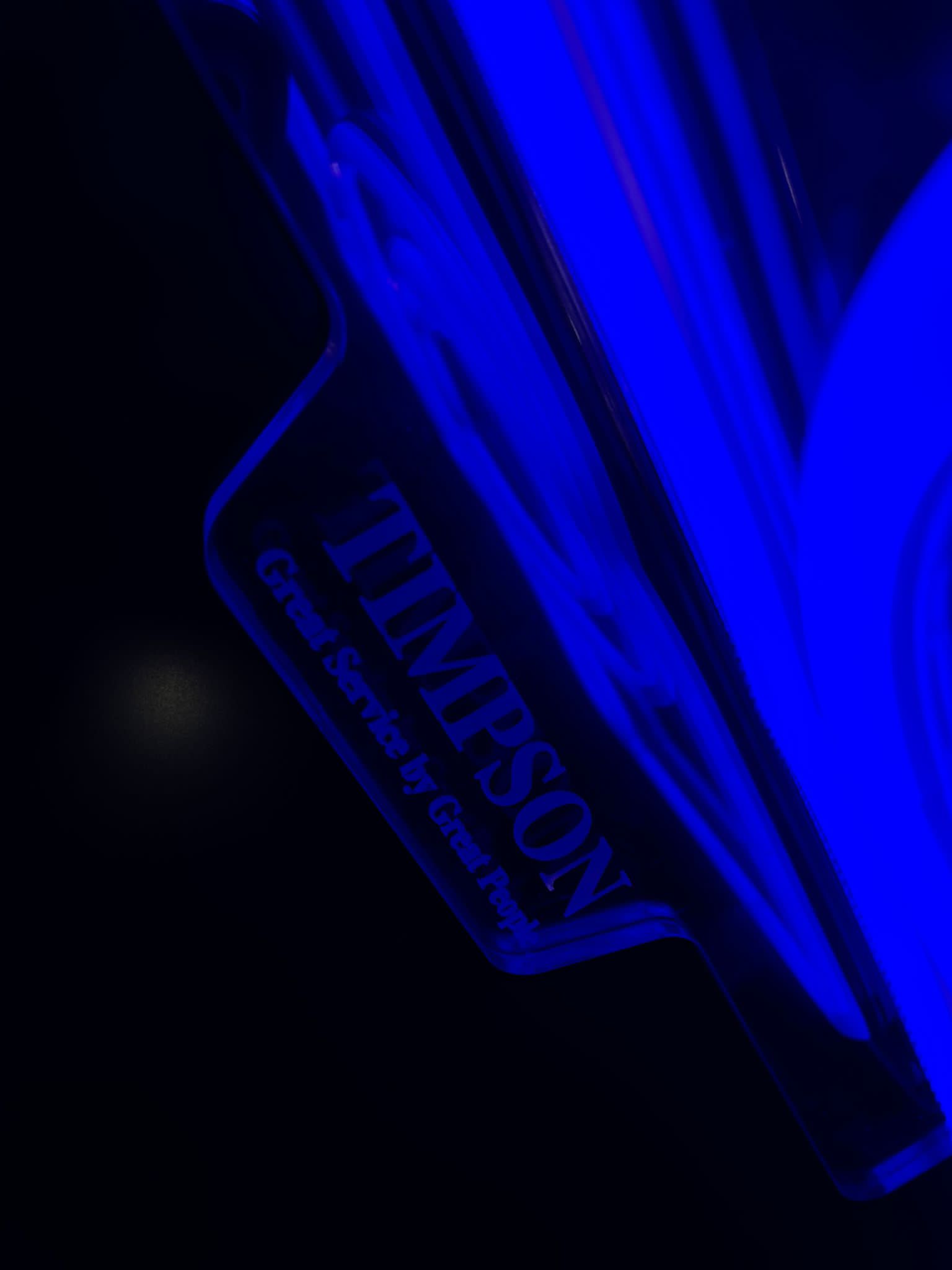 Timpson blue neon detail close-up