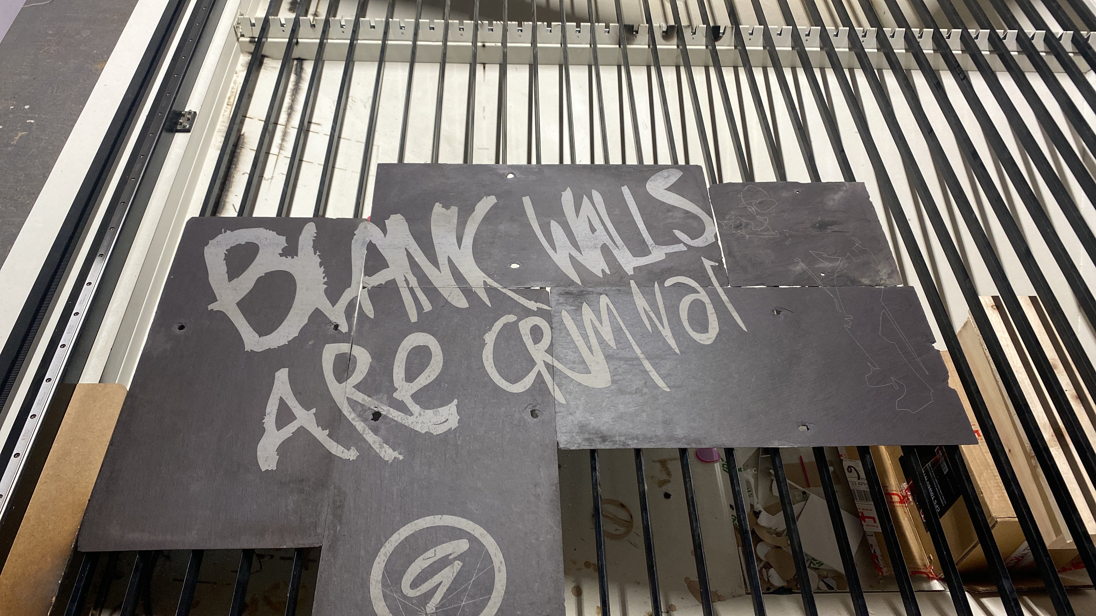 Blank Walls Are Criminal slate panels on CNC bed