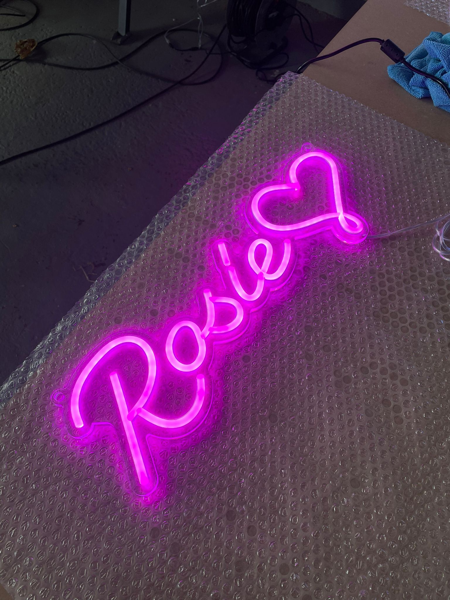 Rosie pink neon on workshop bubble wrap