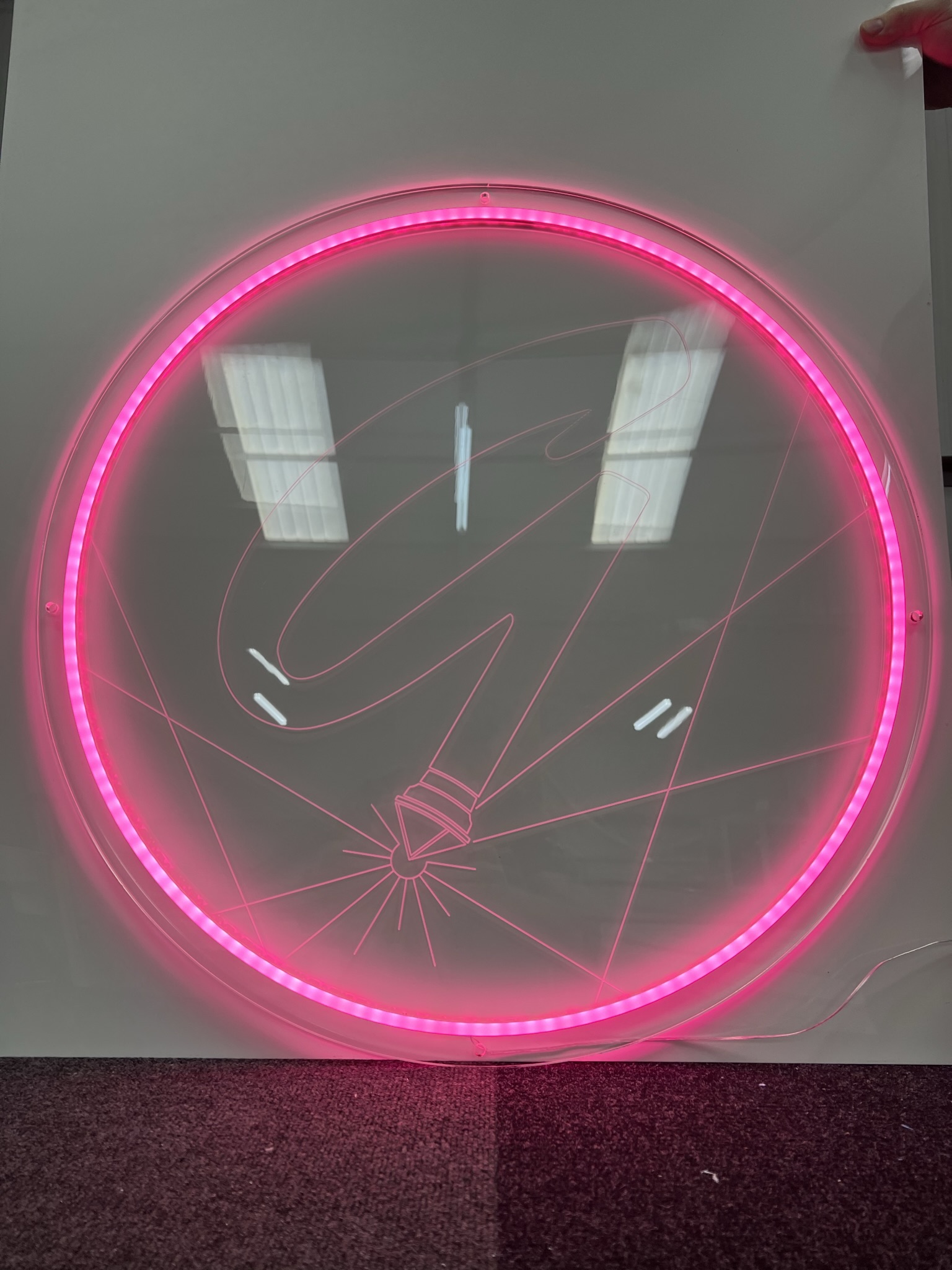 GlamCNC pink G logo LED ring sign on floor