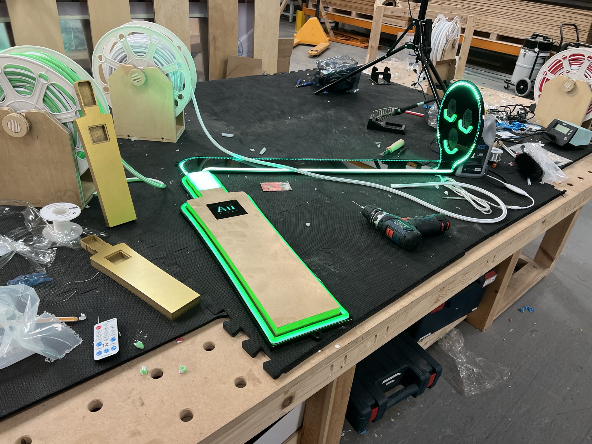 Au Vodka prop assembly with neon strips on bench