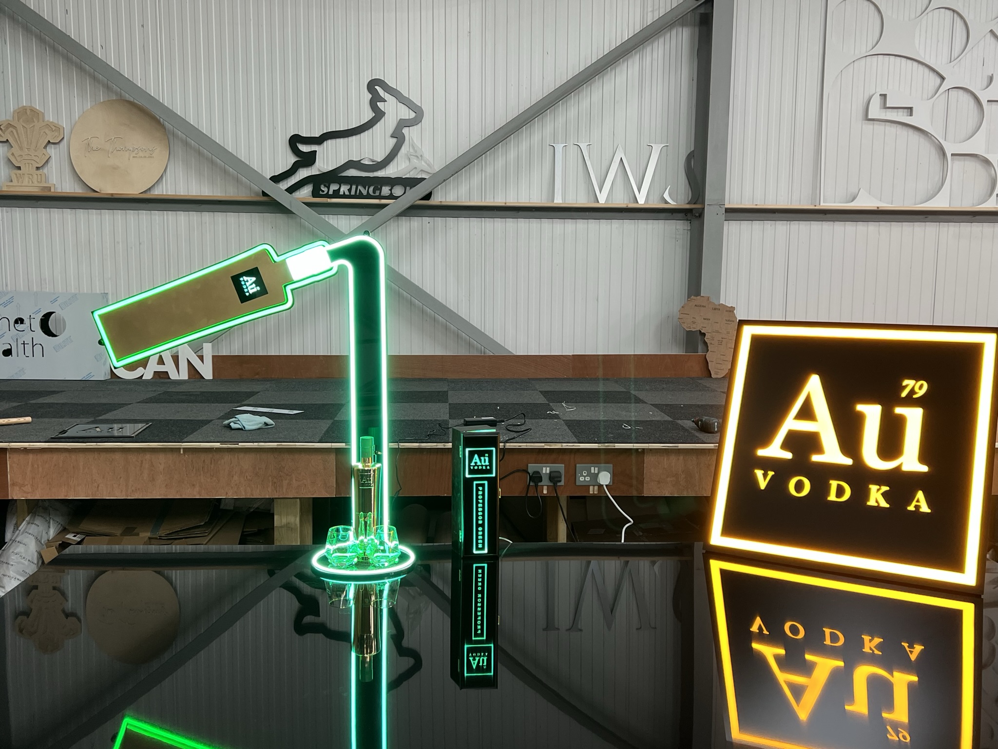 Au Vodka POS display with neon and signage