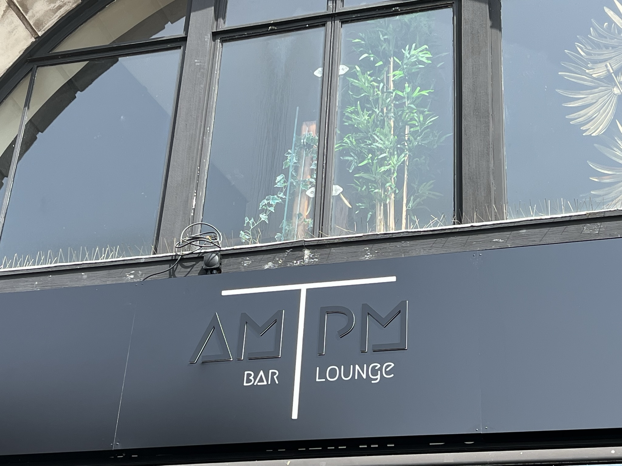 AM PM Bar Lounge fascia close-up