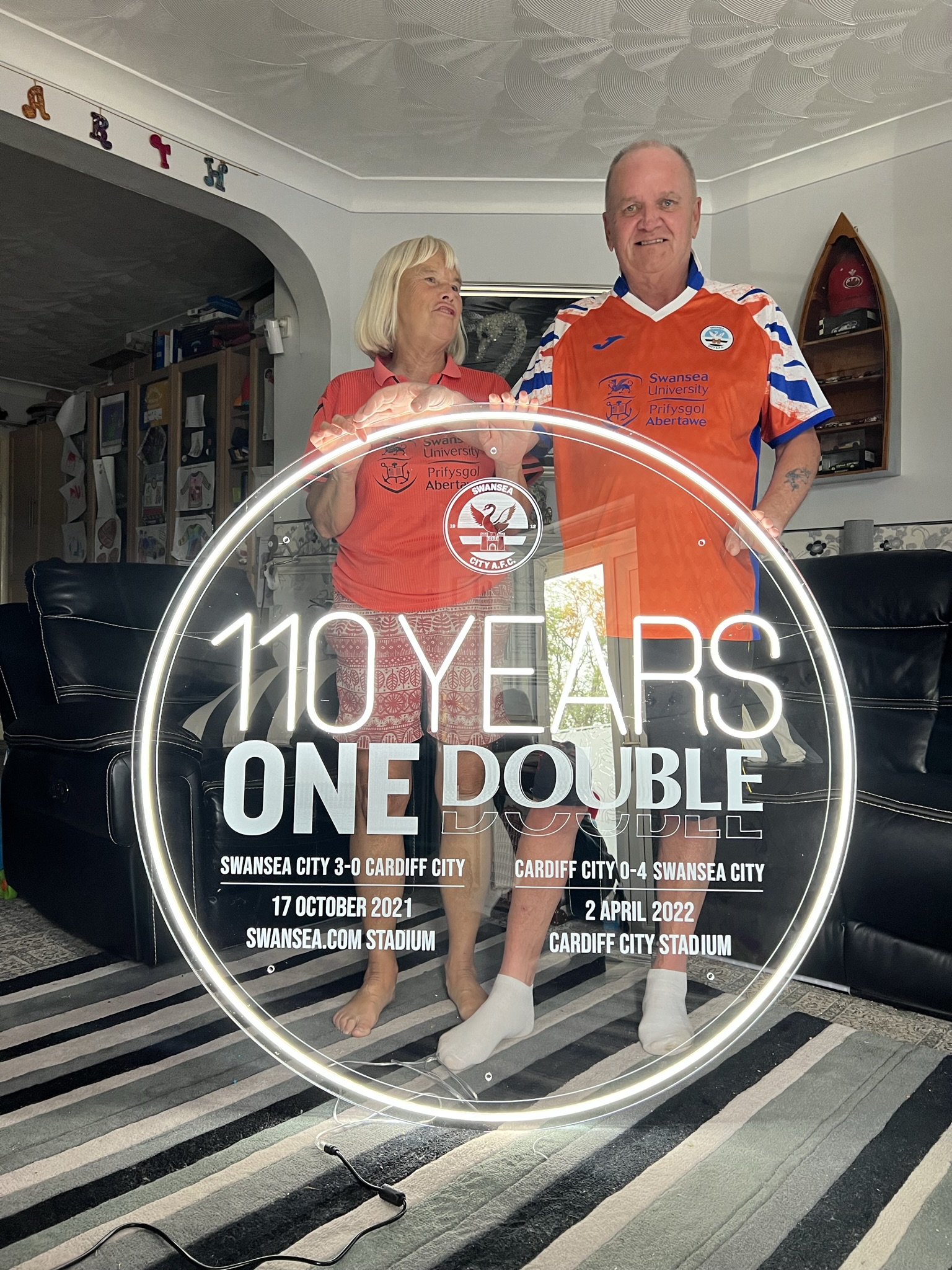 Swansea City 110 Years One Double illuminated sign with customers