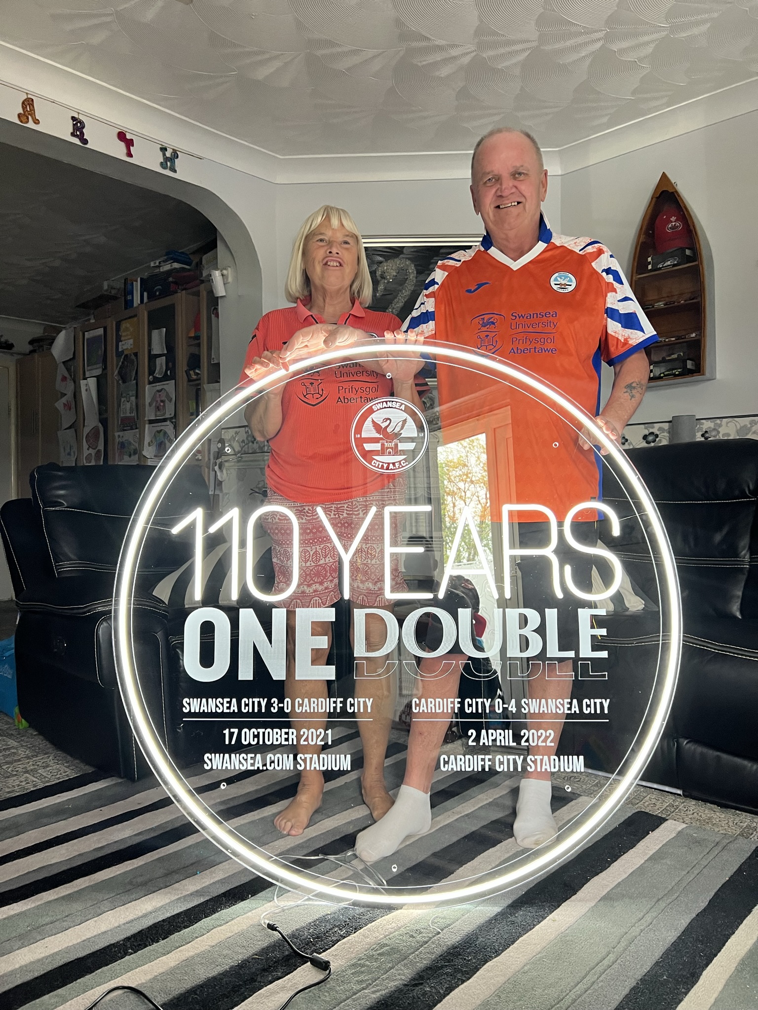Swansea City 110 Years One Double sign with customers