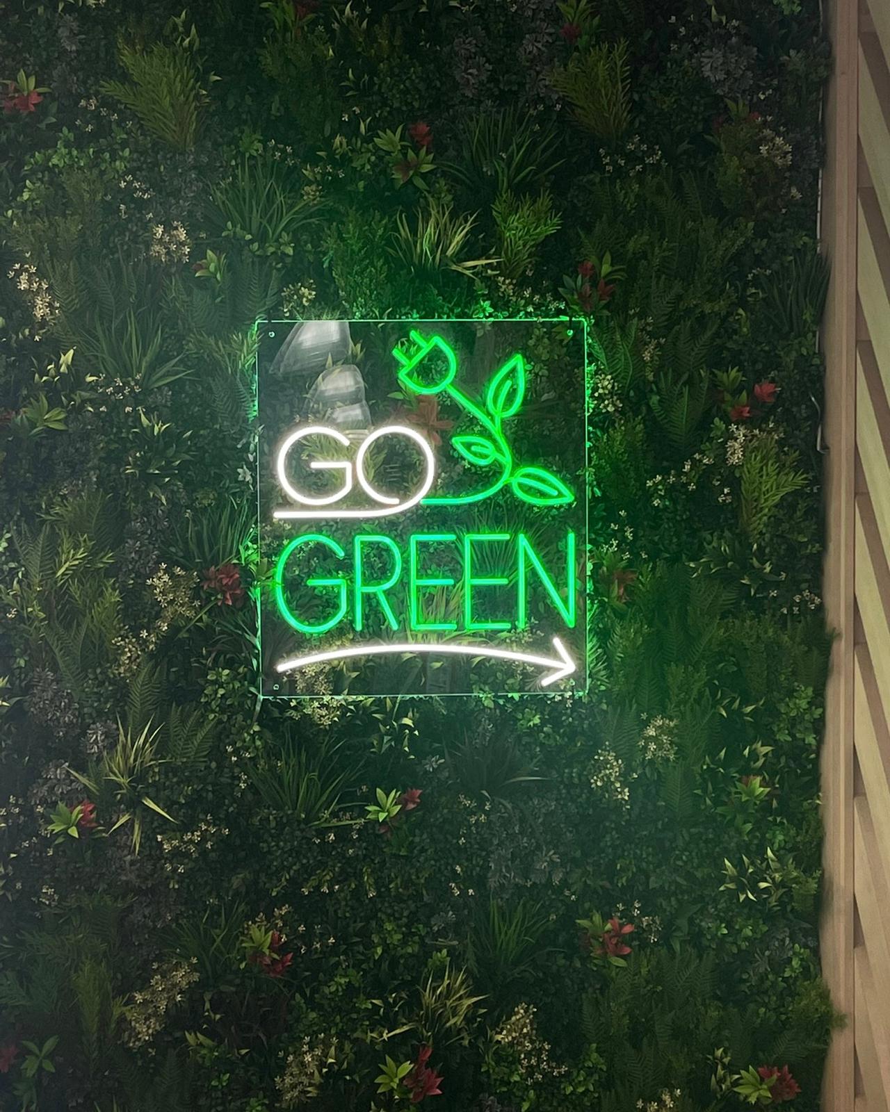 Go Green neon on living plant wall